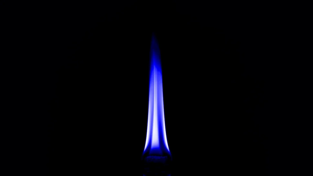 a blue flame on black background