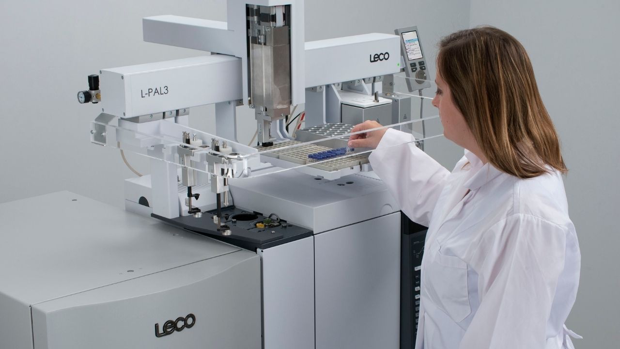 Scientist operating Pegasus BT instrument in a lab