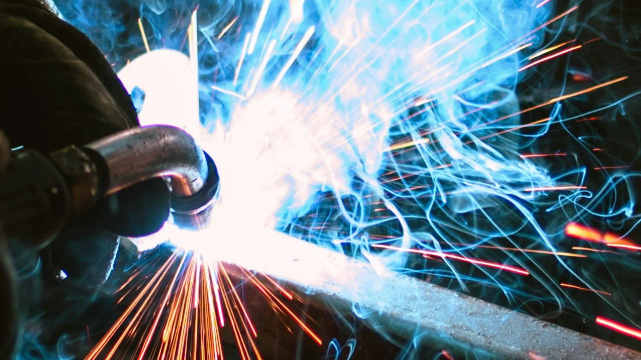 mechanic welding, sparks flying