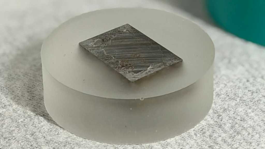 an unpolished metallographic mount after cold mounting process
