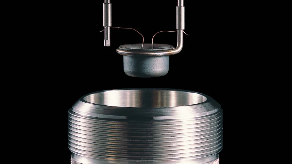Sample being loaded into calorimeter bomb vessel