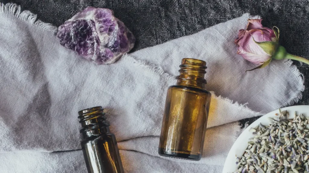 essential oil bottles with various raw supplies
