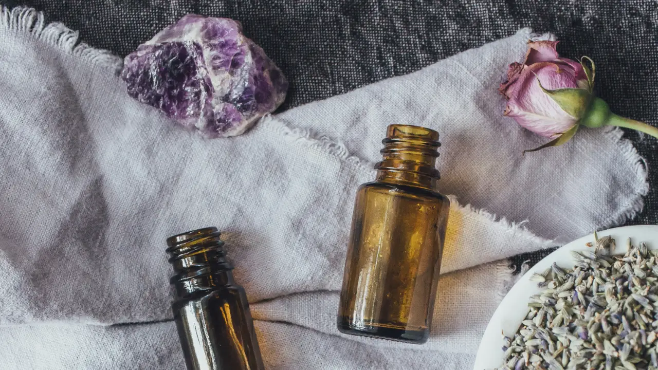 essential oil bottles with various raw supplies