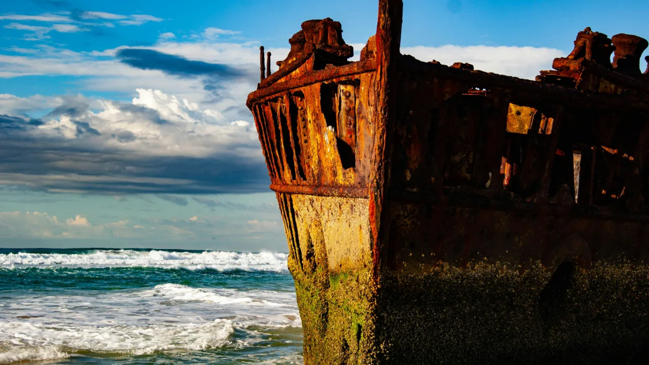 An aging shipwreck in ocean waves